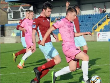  ??  ?? Young striker Danny Doyle posing a threat to Cobh Ramblers defender James McSweeney.