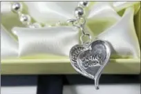  ?? CONTRIBUTE­D PHOTO ?? This sterling silver bracelet, designed by Mira Alicki, with an engraved charm that reads “Forever in My Heart” on one side and “Rescue Me” on the other, was a part of swag bags given to Golden Globes attendees.