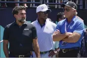  ?? SETH WENIG — THE ASSOCIATED PRESS FILE ?? Yasir Al-Rumayyan, left, governor of Saudi Arabia's Public Investment Fund, Majed Al-Sorour, CEO of Golf Saudi, center, and Greg Norman, CEO of LIV Golf, watch at the first tee during a tournament in July. A federal judge has ruled the head of Saudi Arabia's sovereign wealth fund, the financial backer of LIV Golf, must sit for deposition­s and produce documents in LIV Golf's antitrust lawsuit against the PGA Tour.