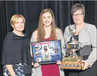  ?? SUBMITTED PHOTO ?? Stratford native Emma Jinks, middle, stands with her junior female athlete of the year award after winning it at the Sport P.E.I. awards Wednesday in Charlottet­own. It’s Jinks’ third straight junior female victory. Also shown are Janet Clark, left, of...