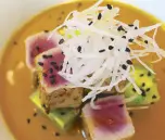  ??  ?? Nikei tuna tataki with leche de tigre with seared tuna, avocado terrine and radishes topped with black sesame seeds