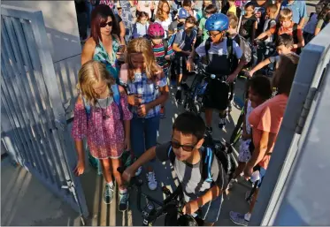  ?? Signal file photo ?? Bridgeport Elementary School students enter the campus at 7:50 a.m. on the first day back to school in August 2017.