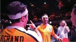  ?? PHOTO COURTESY OF THE BOSTON BRUINS FOUNDATION ?? Bruins Brad Marchand, left, and Patrice Bergeron clown around at the first Pucks and Paddles ping pong tournament last year.