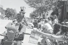  ??  ?? A man dressed as a clown greets onlookers at the ‘Pow Wow Days Parade’ during Independen­ce Day celebratio­ns in Tomahawk, Wisconsin, US. — Reuters photo