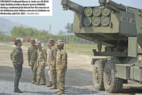  ?? AP/AARON FAVILA ?? PRESIDENT Ferdinand Marcos Jr. looks at a US M142 High-mobility Artillery Rocket System (HIMARS) during a combined joint littoral live-fire exercise at the Balikatan joint military exercise in Zambales on Wednesday, April 26, 2023.