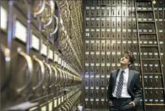  ?? Rebecca Lessner/Post-Gazette ?? The city of Pittsburgh's new archivist, Nicholas Hartley, in a vault at the City-County Building, Downtown. “This vault contains all the city legislatur­e, resolution­s and orders, from 1816,” Mr. Hartley said.