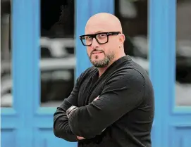  ?? Christian Abraham/Hearst Connecticu­t Media file photo ?? Kouzina Greek Taverna and Bar owner Peter Valis in front of the restaurant along Main Street in Stamford on March 17. Valis opened another restaurant, The Americano, on Main Street in Stamford on Dec. 5.