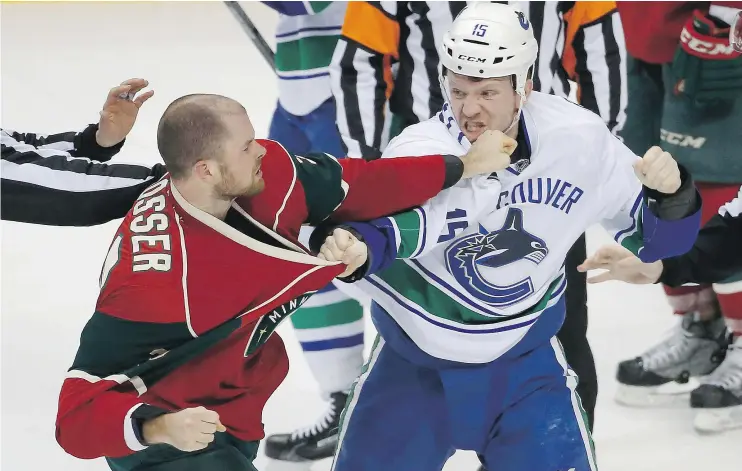  ?? — THE ASSOCIATED PRESS FILES ?? Vancouver Canucks’ tough guy winger Derek Dorsett, right, is concerned about possible flaws in the NHL’s new concussion-protocol system.