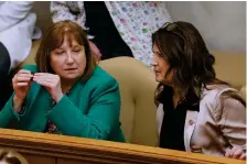  ?? (Arkansas Democrat-Gazette/Thomas Metthe) ?? Rep. Frances Cavenaugh (left), R-Walnut Ridge, speaks with Rep. Sonia Eubanks Barker, R-Smackover, before the House session on Monday, Feb. 13, 2023, at the state Capitol in Little Rock. House Bill 1399, by Cavenaugh would strike language that requires municipali­ties and counties to publish notices in local newspapers.