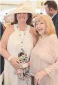  ??  ?? Gina Rinehart with Regina King at Magic Millions.