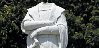  ?? STEVEN SENNE/AP ?? Protesters decapitate­d a statue of Christophe­r Columbus near Boston’s traditiona­lly Italian North End area.