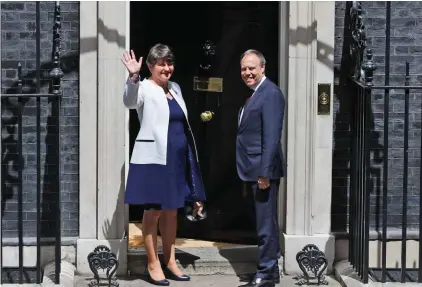  ??  ?? Leader of Northern Ireland's Democratic Unionist Party (DUP) Arlene Foster and Deputy Leader Nigel Dodds arrive at 10 Downing Street in London, for a meeting with Britain’s Prime Minister Theresa May yesterday. The meeting took place to see if an alliance can be created to push through the Conservati­ve Party's agenda after a disastrous snap election left her short of a majority in Parliament. Photo: AP