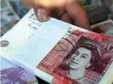  ?? — AFP ?? LONDON: The pound, which has lost 3.7 percent of its value against the dollar since arch-Brexiteer Prime Minister Boris Johnsonís arrival in office in late July, sank to $1.2056, the weakest it has been since January 2017, and was last down by 0.5 percent at $1.2072.