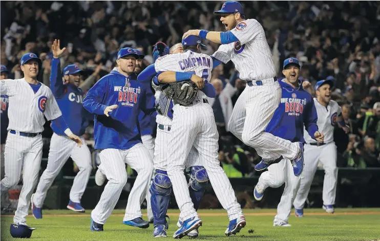  ?? — GETTY IMAGES ?? The Chicago Cubs celebrate after defeating the Los Angeles Dodgers 5-0 in Game 6 of the NLCS to advance to the World Series against Cleveland.