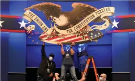  ?? Photograph: Patrick Semansky/AP ?? Workers adjust signage as preparatio­ns take place for the first 2020 presidenti­al debate in Cleveland.