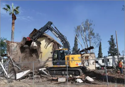  ?? PHOTOS BY MILKA SOKO ?? The historic Lakeman House in Old Town Murrieta, built in 1885for a veteran in the Civil War, is torn down Tuesday. Efforts to save the structure after it was red-tagged in 2016failed, but artifacts from the property will be displayed in the Murrieta Museum.
