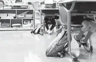  ?? KIM HAIRSTON/BALTIMORE SUN ?? Students enrolled in The Student Learning Center at HendersonH­opkins, a charter school in East Baltimore, work on laptops in an in-person setting in 2020.