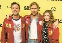  ?? JACK PLUNKETT/INVISION ?? David Leitch, from left, Ryan Gosling and Kelly Mccormick are seen March 12 at SXSW in Texas.
