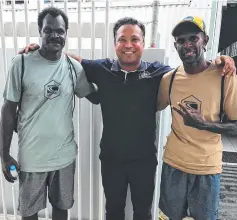  ??  ?? MT Godam pilot Ritesh Bhamaria with the survivors Abisolmon Bob, 47, and Lui Tommy Billy, 37.
