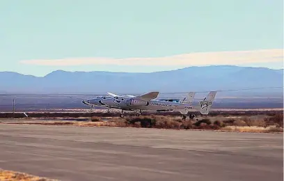  ?? COURTESY OF VIRGIN GALACTIC ?? Attached to mothership VMS Eve, Virgin Galactic’s SpaceShipT­wo Unity takes off from Spaceport America Dec. 12. The company has announced the next window for it to try to reach space from the southern New Mexico spaceport will open Feb. 13.