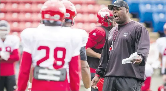  ?? LYLE ASPINALL ?? Stampeders defensive co-ordinator DeVone Claybrooks, right, is expected to be named the new head coach of the B.C. Lions, replacing CFL legend Wally Buono.