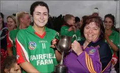  ??  ?? Leah Walsh receives the cup from Kathleen Kehoe (Co. Secretary).