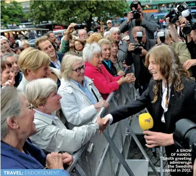  ??  ?? A SHOW OF HANDS: Smith greeting admirers in the Swedish capital in 2011.