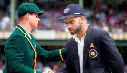  ??  ?? Australia’s Steven Smith (left) and Indian captain Virat Kohli in this file photo.