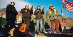  ??  ?? PORTLAND: Native Americans from left, Eugene Sanchez, Jason Umtuch, Martan Mendenhall, and Hugh Ahnatock, all of Portland, Oregon, drum and sing at the Oceti Sakowin camp where people have gathered to protest the Dakota Access oil pipeline in Cannon...