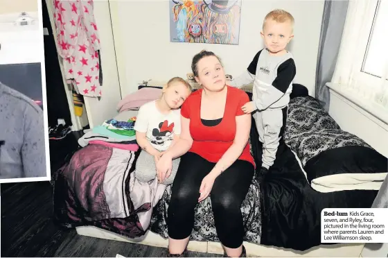  ??  ?? Bed-lum Kids Grace, seven, and Ryley, four, pictured in the living room where parents Lauren and Lee Williamson sleep.