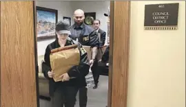  ?? Genaro Molina Los Angeles Times ?? FBI AGENTS collect materials from Councilman Jose Huizar’s office in L.A. City Hall, part of a coordinate­d operation carried out through sealed search warrants.