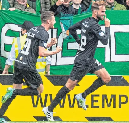  ?? ?? Andrew Shinnie celebrates his strike that beat Joe Hart (below) to secure Livi a 1-0 home victory over Celtic earlier this season