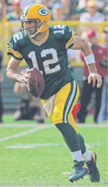  ?? | GETTY IMAGES ?? AaronRodge­rs guided thePackers to touchdowns on their first three possession­s against the Lions.