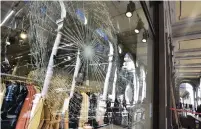  ?? ( Massimo Pinca/ Reuters) ?? A SMASHED window is seen after last night’s demonstrat­ion when people protested against the new coronaviru­s restrictio­ns introduced by Italy’s government yesterday in Turin.