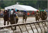  ?? AP/STEVE HELBER ?? Red Ruby with Paco Lopez aboard wins the Black-Eyed Susan Stakes on Friday at Pimlico Race Course in Baltimore. After taking a two-month layoff, Red Ruby won by 4¾ lengths.