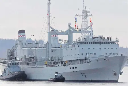  ?? ANDREW VAUGHAN / THE CANADIAN PRESS ?? HMCS Preserver, one of Canada’s operationa­l support ships, designed to carry large amounts of fuel, provisions, and dry stores during naval operations, is pushed by tugs in Halifax harbour in October 2011. Its name, and that of HMCS Protecteur, will live on in new supply ships.