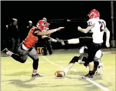  ?? MARK HUMPHREY ENTERPRISE-LEADER ?? Farmington senior defensive end Jae Woods broke through the line to block Maumelle’s first extra-point kick. The failed P.A.T. loomed large in the Cardinals’ 31-30 overtime win on senior night Friday.