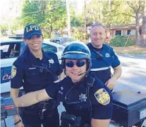  ?? ORLANDO SENTINEL FILE PHOTO ?? Nathaniel Tuck, center, left the Longwood Police Department prior to his arrest in the Capitol riot. Kevin Tuck, right, resigned, and Gabriela Tuck, Nathaniel Tuck’s wife, remains on duty.