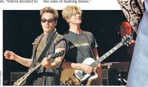  ?? ?? CH-CH-CHANGE OF TUNE: Bowie, along with bandmate Earl Slick (above left), recorded the album “Toy” (left, out today) in the summer of 2000. Anticipati­ng the era of surprise album drops, the visionary musician wanted to release “Toy” right away, but his then-label Virgin Records refused, shelving it instead.