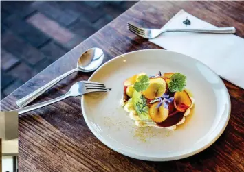  ??  ?? Right: heirloom tomato, peach, whipped feta and sourdough. Below: chef Guy Stanaway.