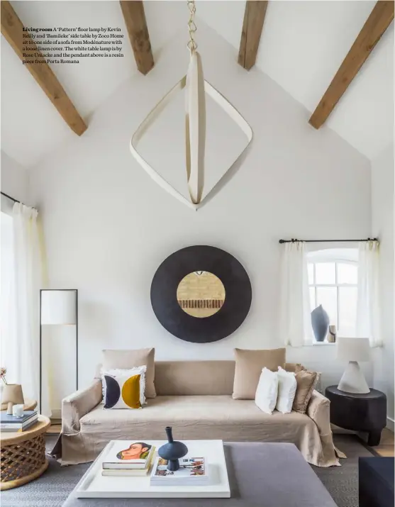  ??  ?? Living room A ‘Pattern’ floor lamp by Kevin Reilly and ‘Bamileke’ side table by Zoco Home sit to one side of a sofa from Modénature with a loose linen cover. The white table lamp is by Rose Uniacke and the pendant above is a resin piece from Porta Romana