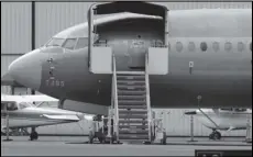  ?? Associated Press ?? In this April 8 file photo, a Boeing 737 MAX 7 jet is parked near single engine planes at the airport adjacent to a Boeing Co. production facility in Renton, Washington.