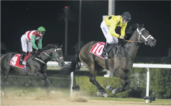  ?? Reem Mohammed / The National ?? Jockey George Buckell made all the running on Syncopatio­n to win the Emirates Skywards handicap race at the Meydan Racecourse