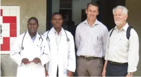  ??  ?? MAKING A DIFFERENCE: African doctors Mruma and Christian with Dr Andrew Browning and Toowoomba’s Dr Geoff Kelsey (right).