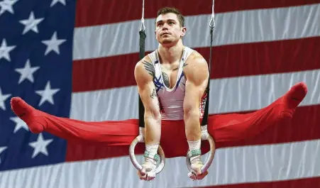  ?? Elise Amendola / Associated Press ?? Colin Van Wicklen of Houston performs his routine on the rings during the USA Gymnastics national championsh­ips Saturday.