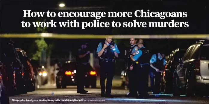  ?? TYLER LARIVIERE/SUN-TIMES ?? Chicago police investigat­e a shooting Sunday in the Lawndale neighborho­od.