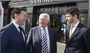  ??  ?? Ian Daly from Cardinal Capital Group, Sam McCauley and Jonathan Cosgrave, from the Carlyle Group at last week’s investment announceme­nt outside Sam McCauley’s Greystones outlet.