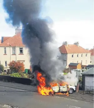  ??  ?? The Kia Sportage exploded into flames in Macindoe Crescent, Kirkcaldy.