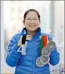  ?? SUBMITTED PHOTO ?? Linh Huynh clutches four medals having completed the 4Deserts Grand Slam — something very few women have managed to do. She will be sharing her personal story of triumph at Chinook Village on March 27.