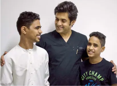  ?? Supplied photo ?? Dr Attawar Sandeep with the Emirati siblings, Hamad and Mohammed, who underwent cadaver heart transplant­s. —
